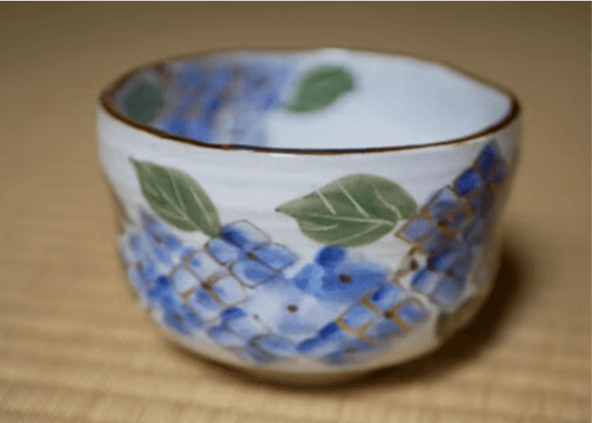 Handcrafted matcha bowl Kyoto featuring a beautiful blue and green floral design