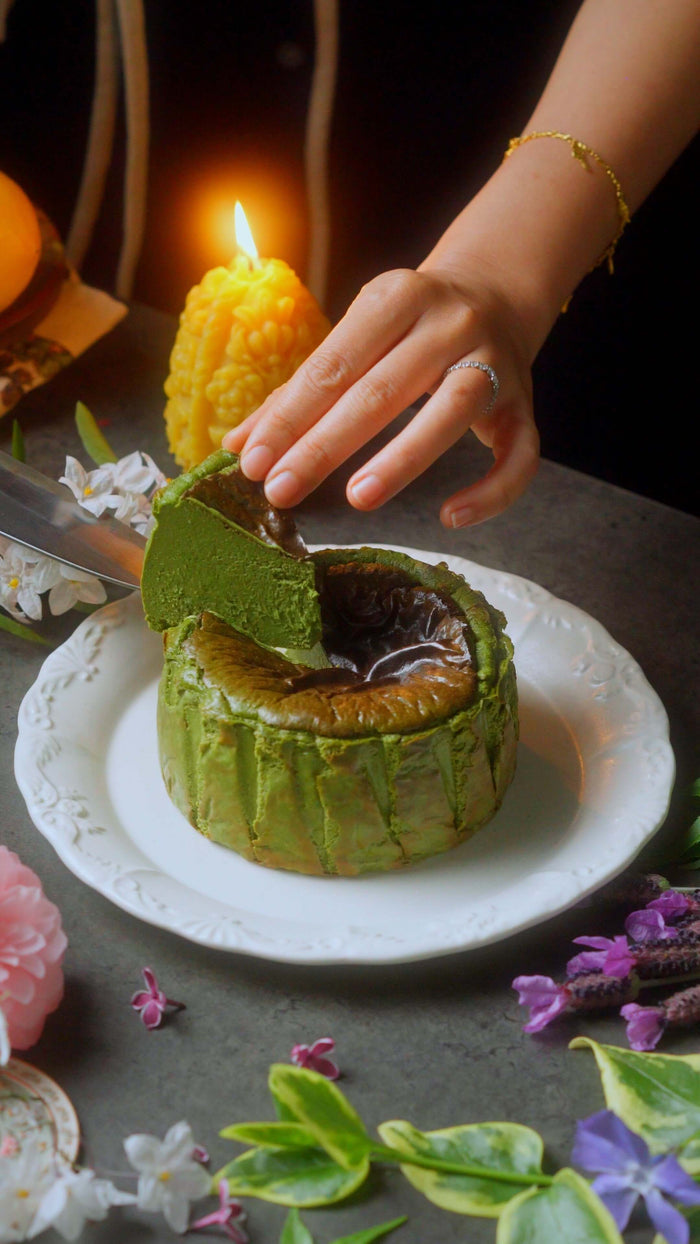 Delicious Keto Matcha Basque Cheesecake Recipe being sliced on a decorative plate
