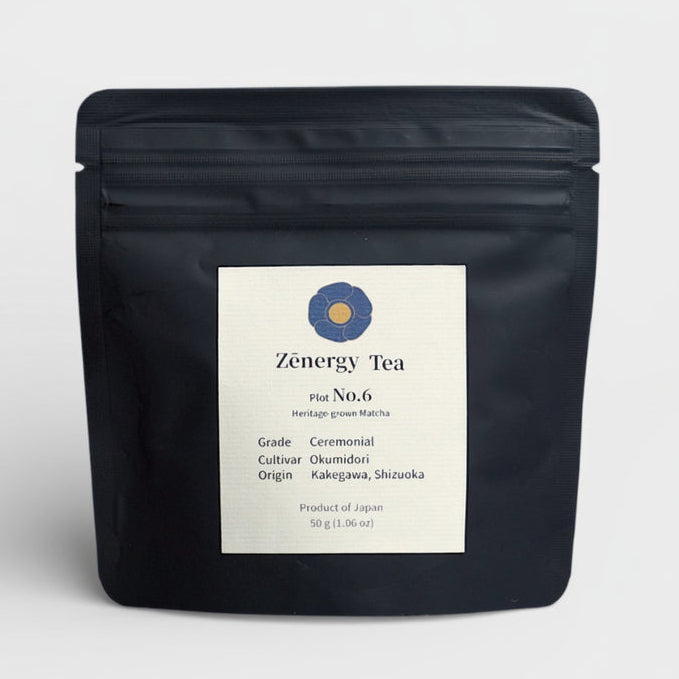 Black tea package with a label on a light gray background