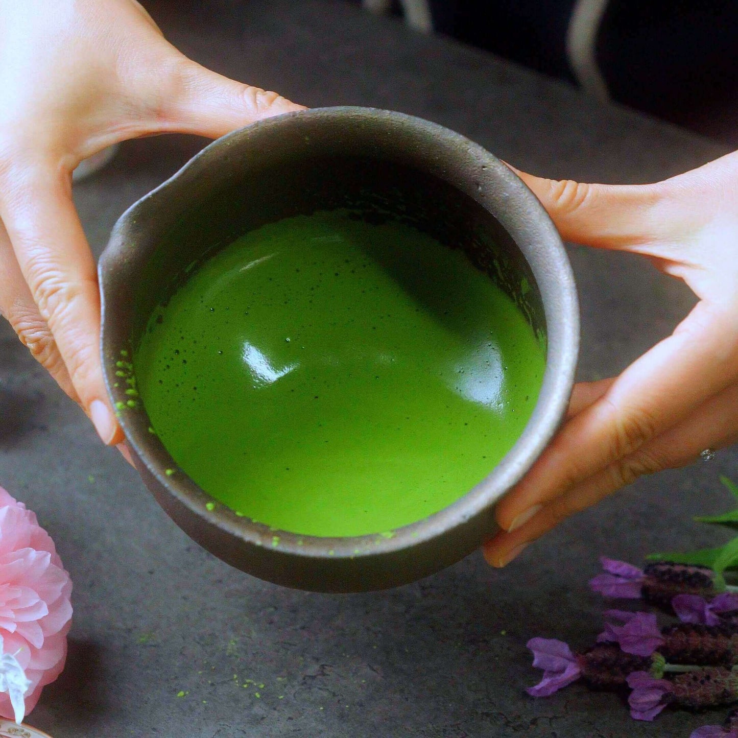 Freshly whisked ceremonial matcha Japan served in a traditional black bowl