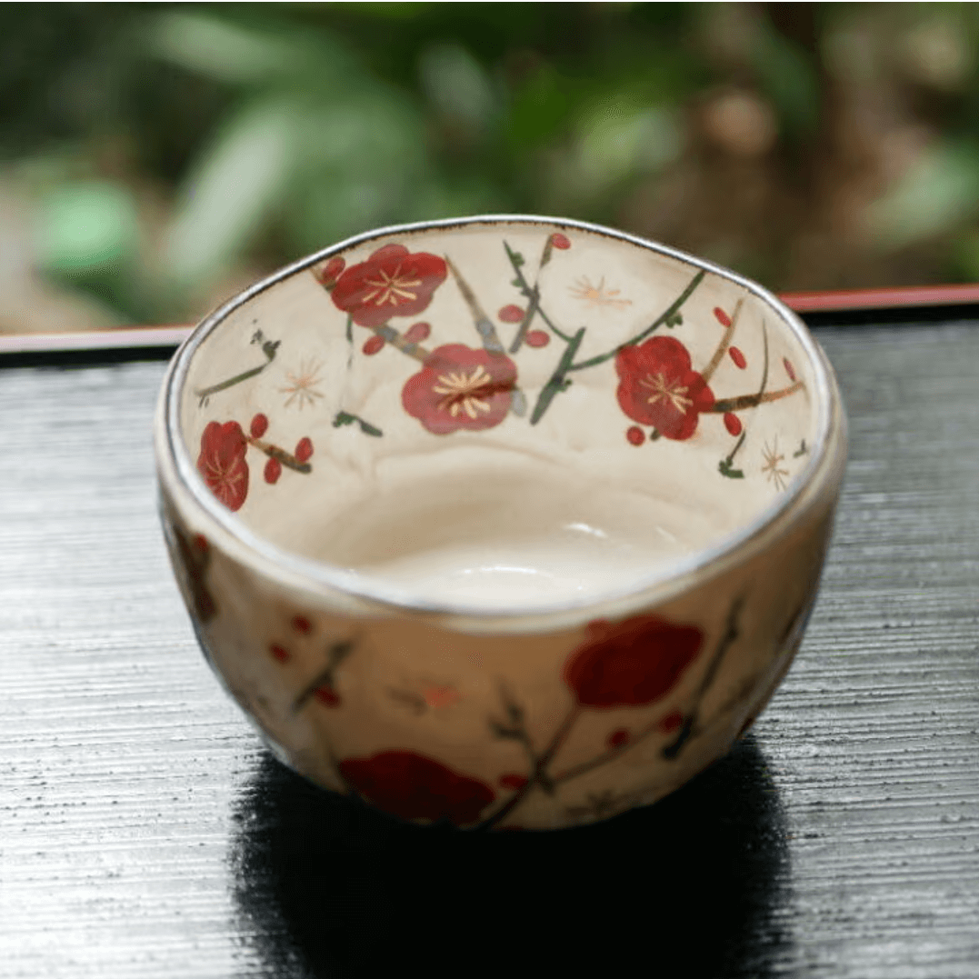 Handcrafted Japanese matcha bowl with floral design, perfect for traditional tea ceremonies